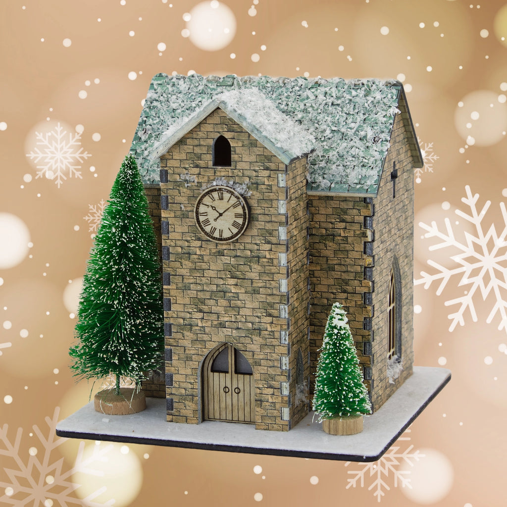 Model of a clock tower with snow on the roof, surrounded by snowflakes on a beige background.
