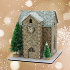 Model of a clock tower with snow on the roof, surrounded by snowflakes on a beige background.