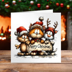 Christmas card with a humerous cat design on a wooden table with a blurred background.