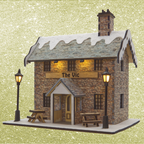 Model of a stone building with 'The Vic' sign on a glittery gold background