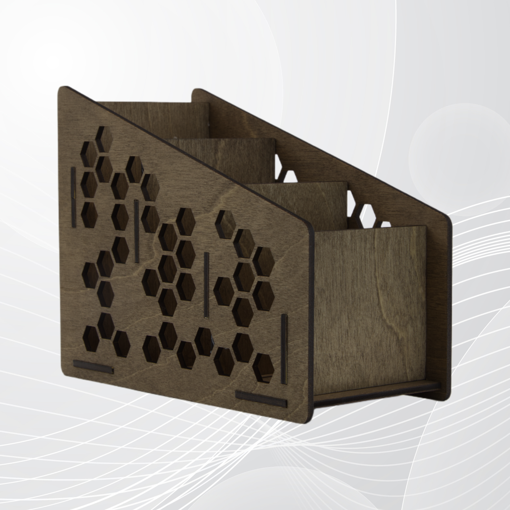 Wooden remote control holder with honeycomb design on a white background