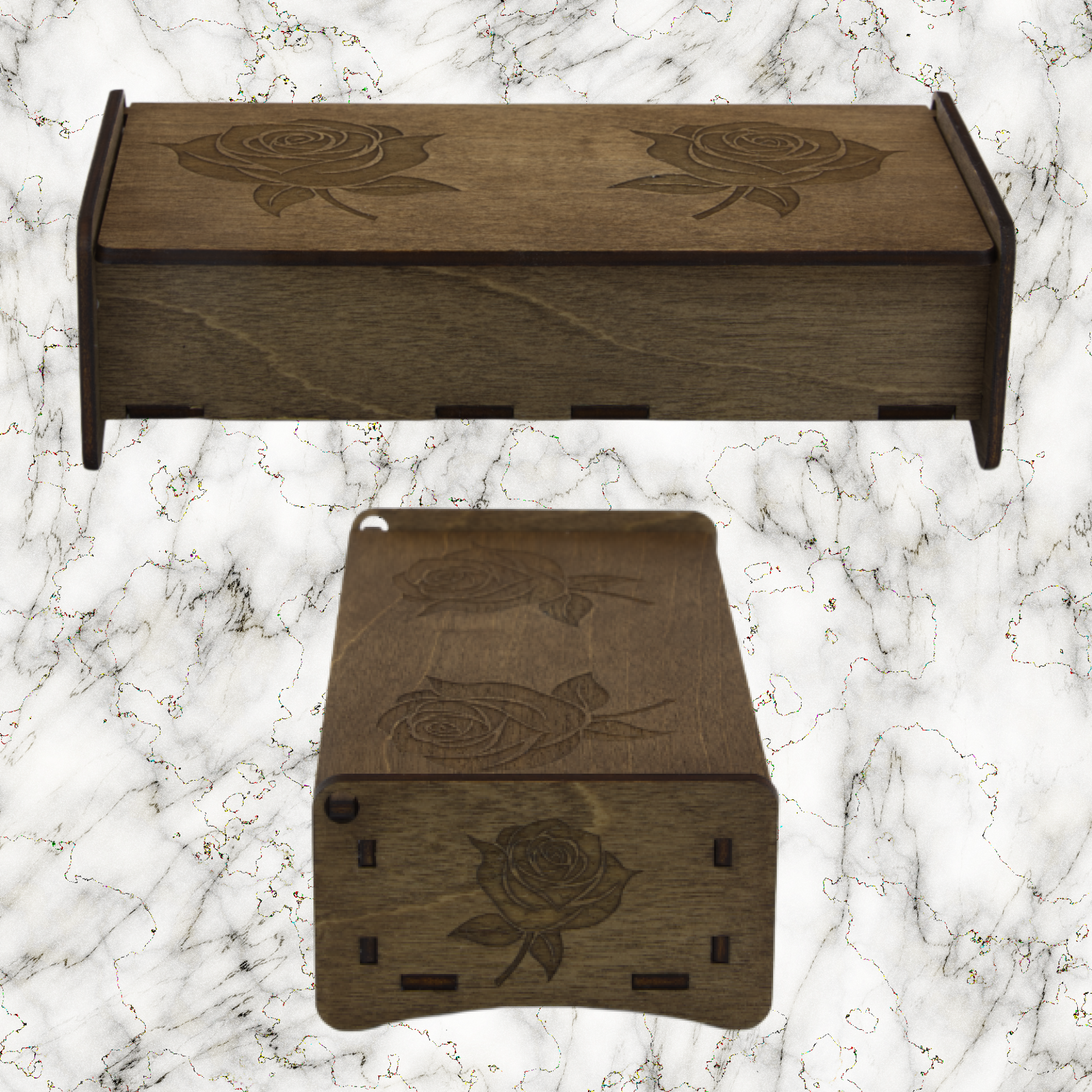 Two wooden boxes with engraved rose designs on a marble surface