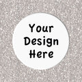 Circular white coaster with 'Your Design Here' text on a silver glittery background