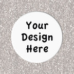 Circular white coaster with 'Your Design Here' text on a silver glittery background