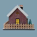 A miniature brick house model with a snow-covered gray roof, a glowing yellow windows and a beige picket fence around it, shown on a plain blue-gray background.